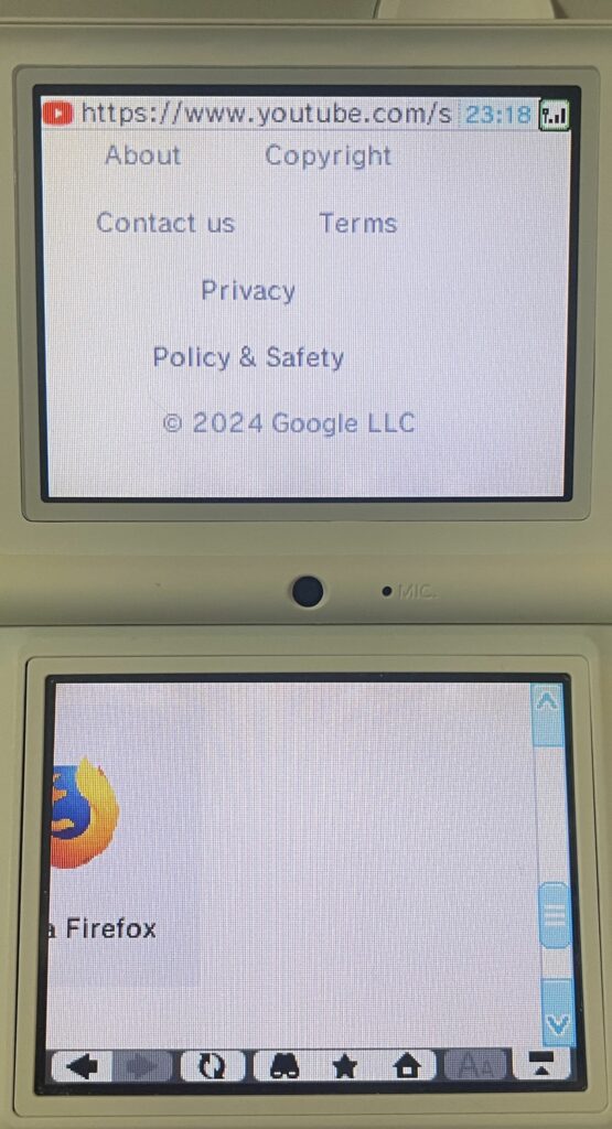 DSi browser header visible with "https://www.youtube.com". Various links are visible on the top display. On the bottom display, the Firefox logo is partially visible, as is the word "Firefox", but nothing else can be seen.